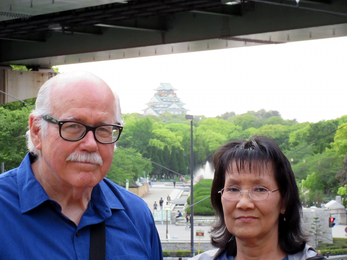 us with Osaka Castle in background